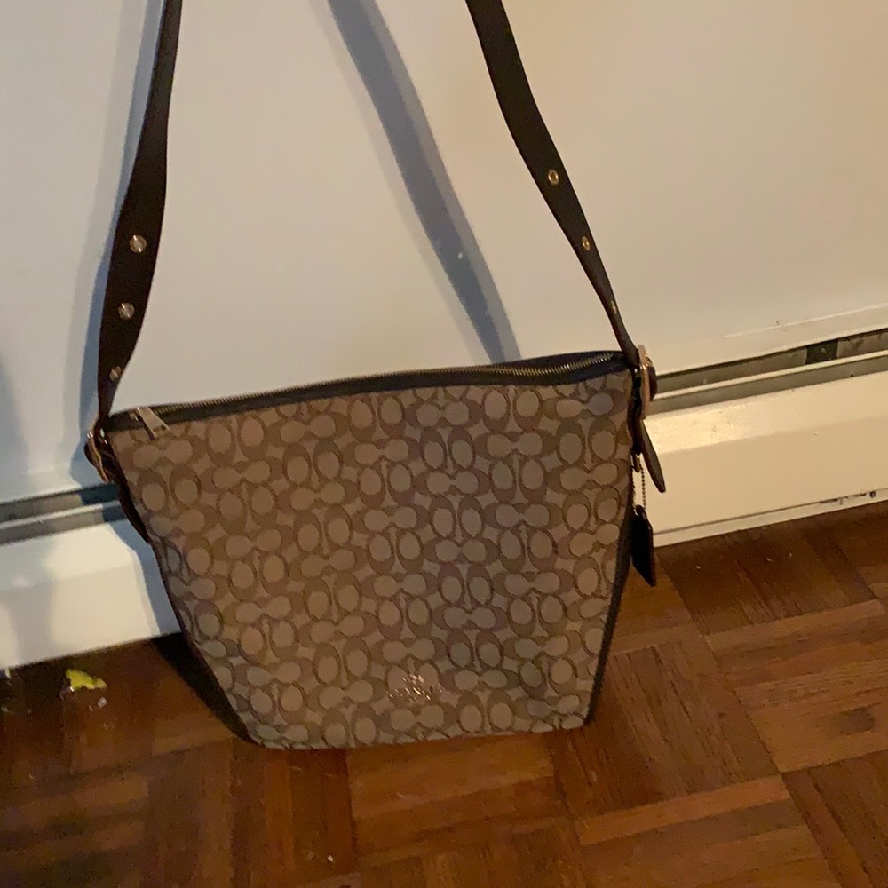 Brown and Tan Coach Duflette